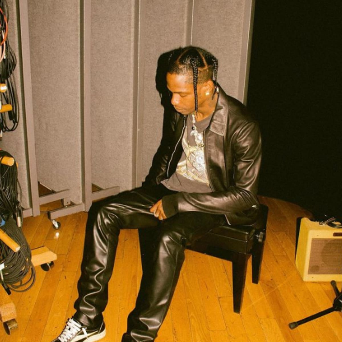 Travis Scott teases the release of first album in four years by HANDCUFFING  it onto his bodyguard